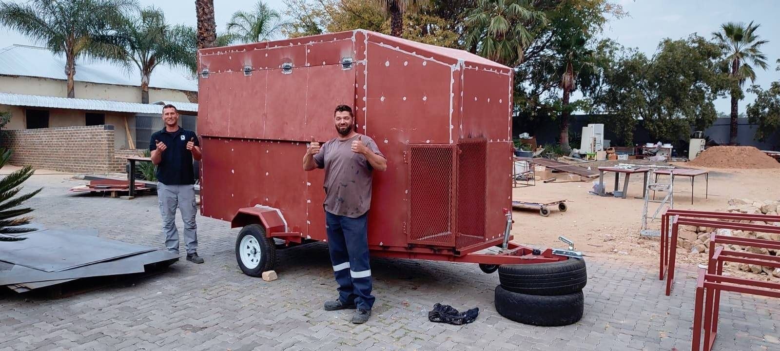 A red trailer on the property