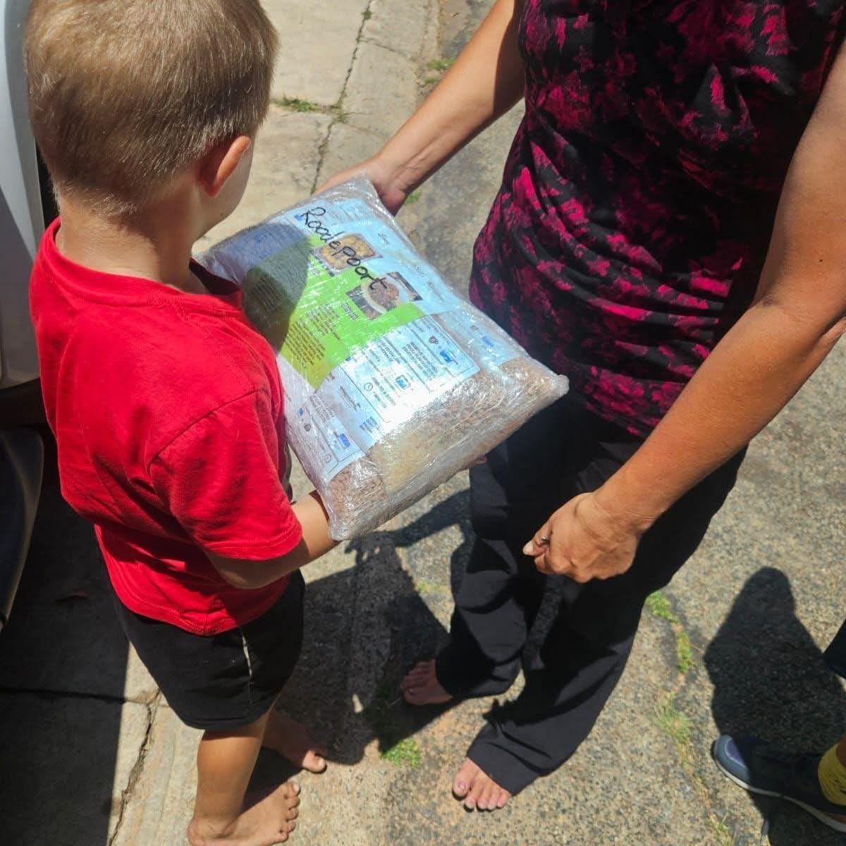 A child receiving a Veggie Meat packet
